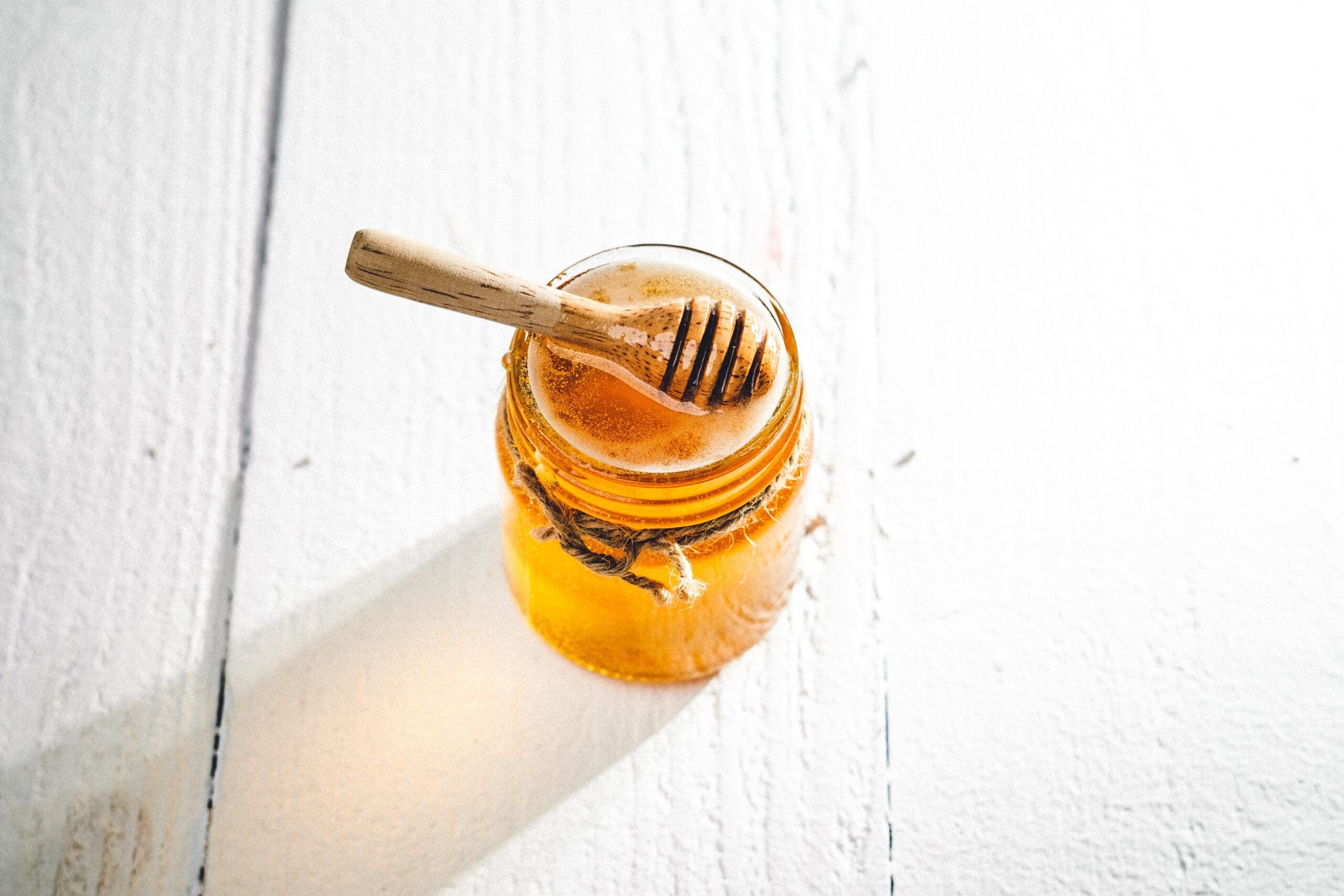 A jar of honey to add a touch of sweetness to a dish to balance flavors