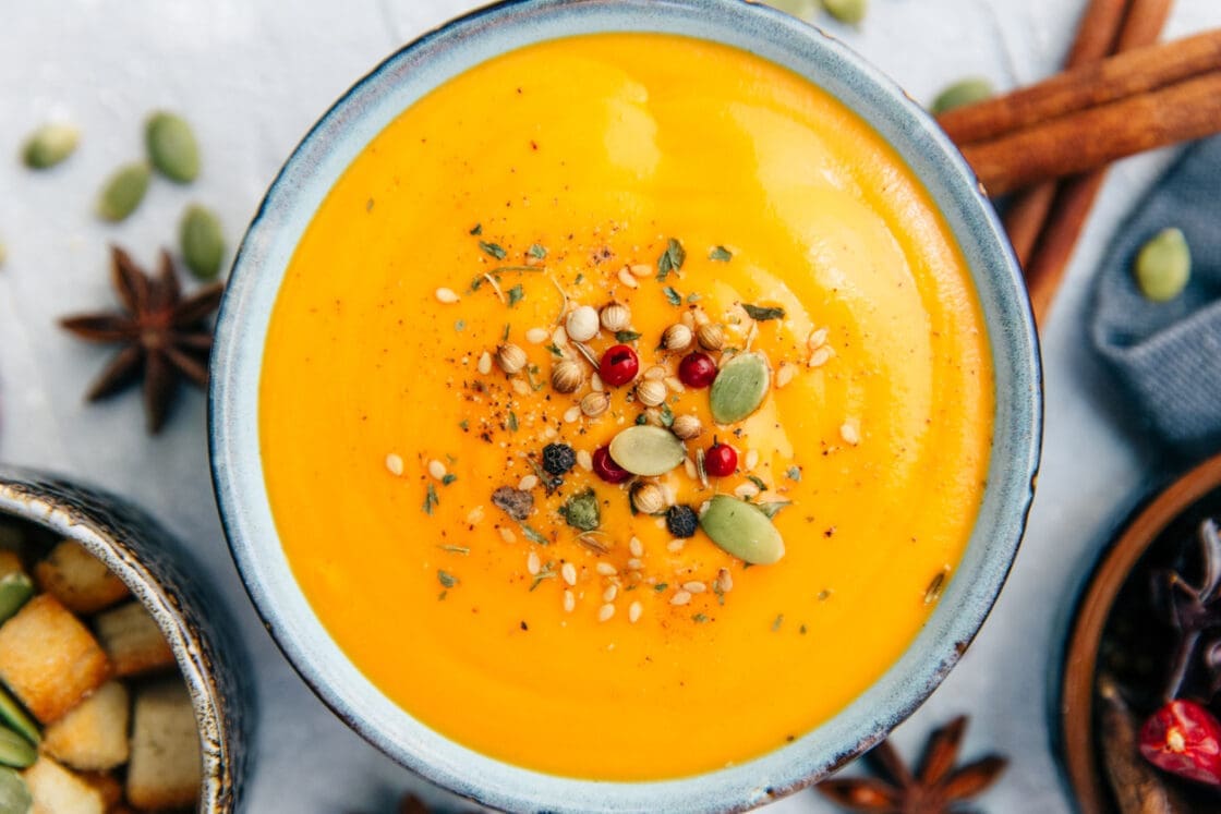 Can you eat heirloom pumpkins? This soup is proof — heirloom pumpkin squash soup topped with pepitas, pomegranate seeds, and hemp seeds.