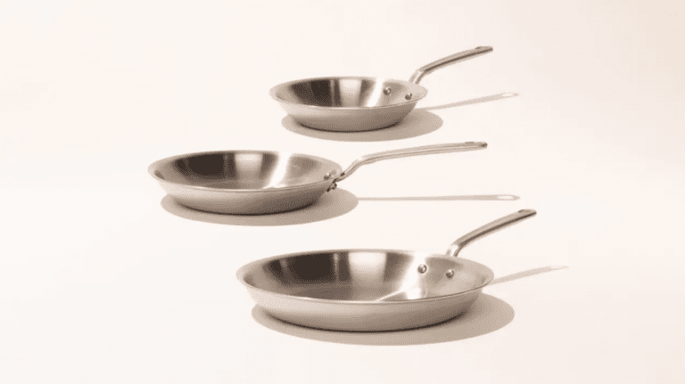 Made In stainless steel 3-piece frypan set on plain, neutral background showing the differences and advantages of stainless steel vs carbon steel vs cast iron