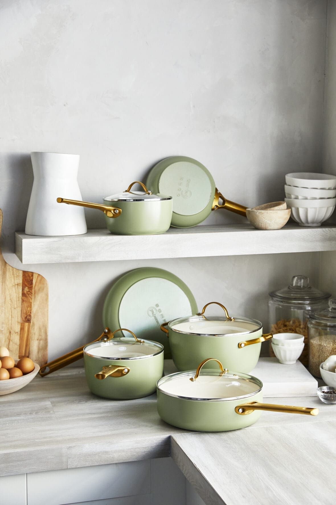 image of a colorful greenpan cookware set that looks beautiful in a modern kitchen stacked on the counter and on a shelf