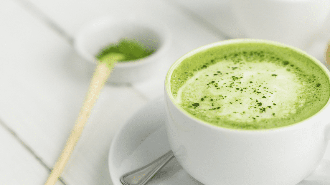 image of matcha latte drink. you don't have to go to a cafe to get a matcha latte iced or hot. how do you make a matcha latte? Here's how.