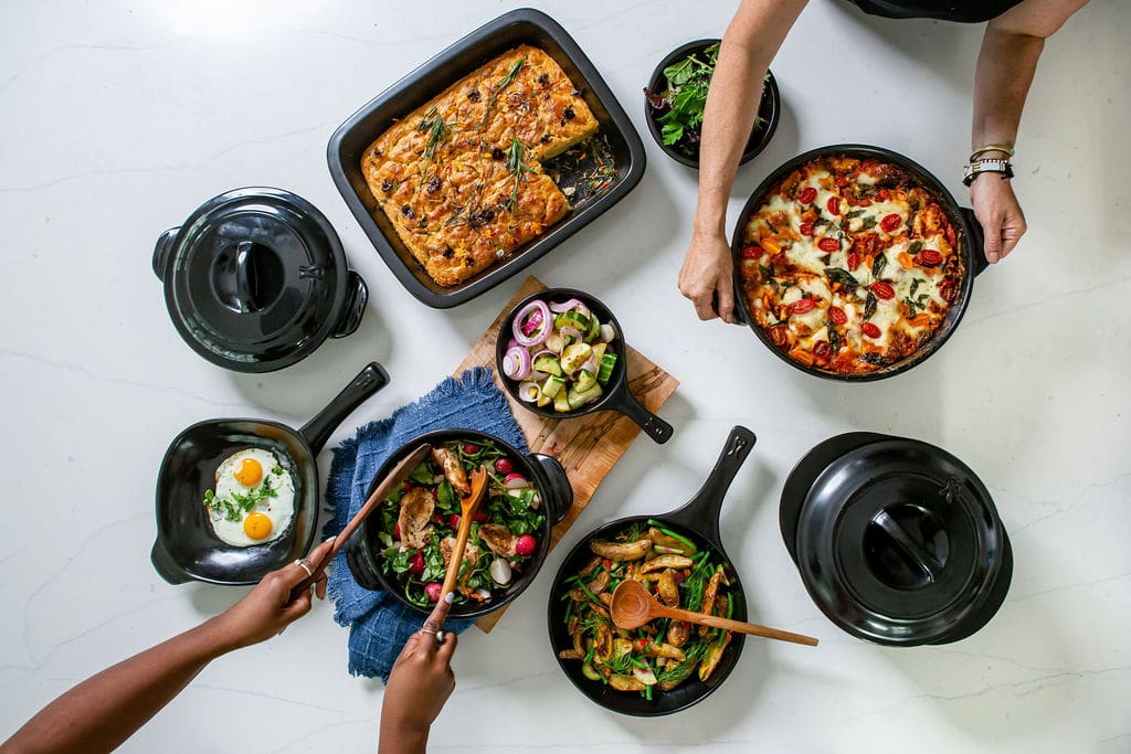Image of an overhead shot of ceramic Xtrema Cookware serving up inviting, colorful food that looks inviting and surprisingly beautiful in durable cookware.