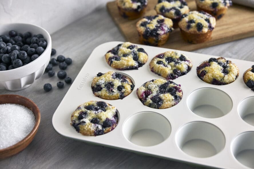 Image of the GreenPan Reserve muffin pan in twilight being used to bake blueberry muffins.