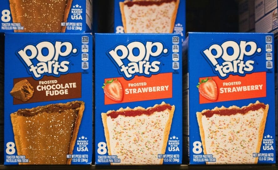 Image of three boxes of Pop Tarts in two different flavors displayed on a shelf.