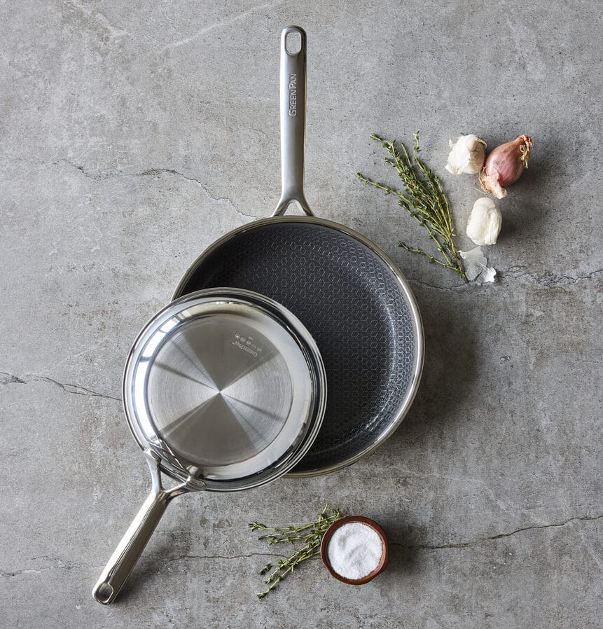 Image of the GreenPan Spectra frypan duo, displayed one on top of another on a counter.