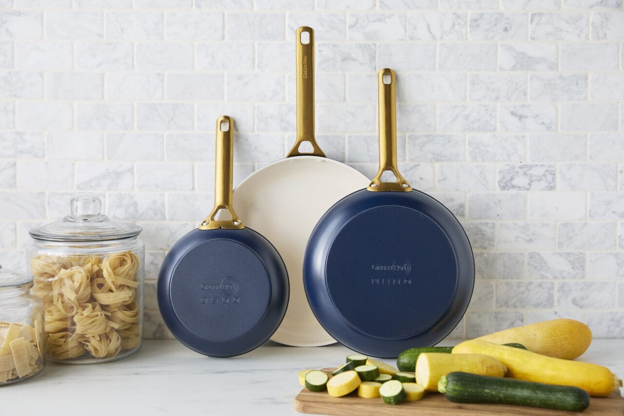 GreenPan Reserve Pro frypan trio on their sides against a marble backsplash