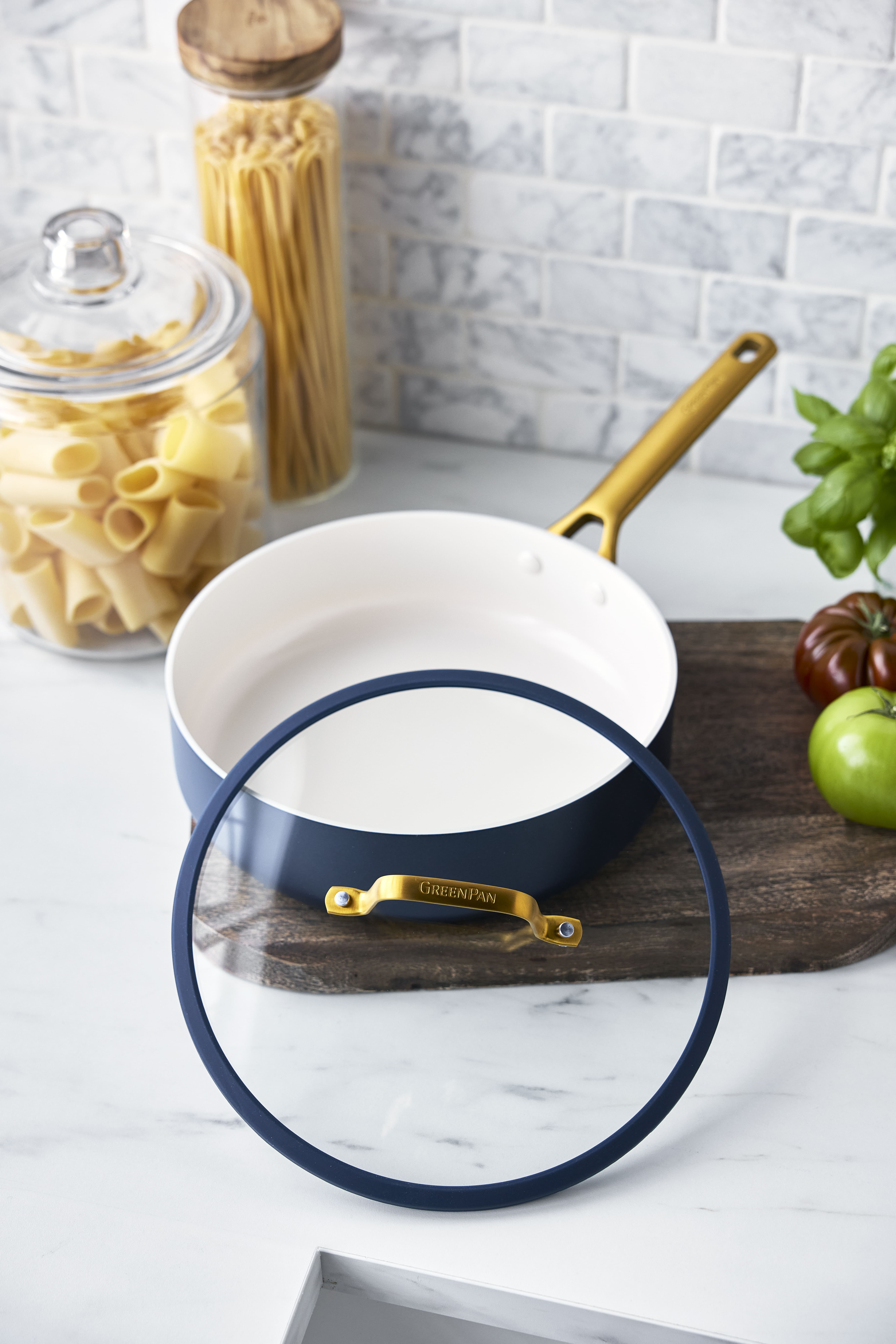 Image of a GreenPan Reserve Pro saute pan with matching lid in a pretty midnight blue color