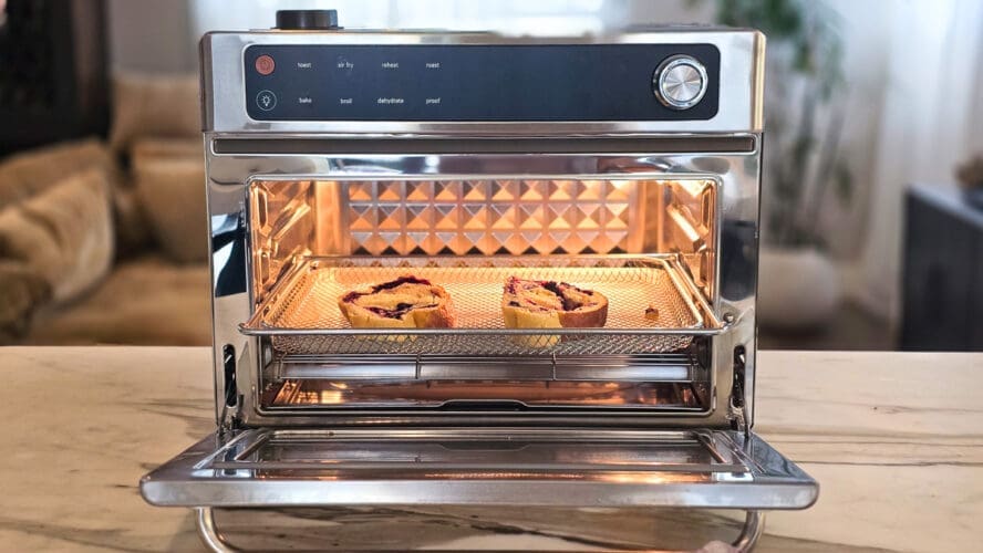 Image of the Our Place Wonder Oven Pro in stainless steel being used to toast two slices of bread.