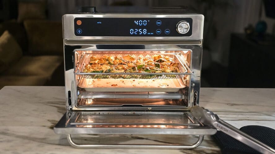 Image of the Our Place Wonder Oven Pro in stainless steel being used to roast zucchini, with its digital display showcasing the oven on 400 degrees Fahrenheit.